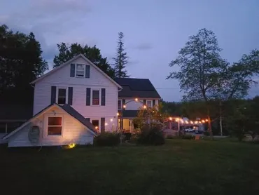 Porch lit up at dusk